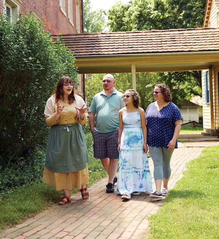 Costumed volunteer giving tour of Zoar Village.